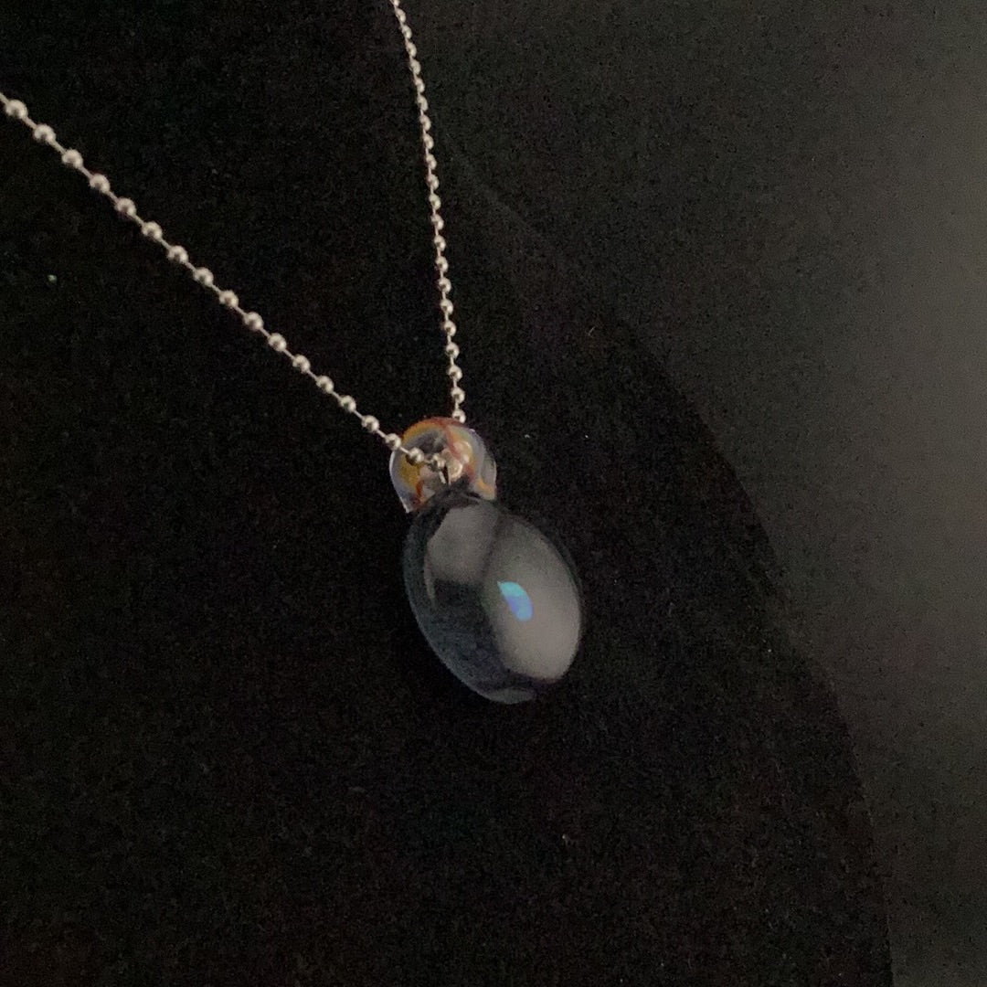 Opal encasement pendant